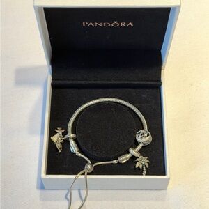 Snake Chain Slider Bracelet
Sterling silver with charms